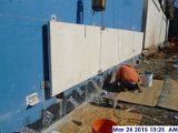 Installing the hand set stone panels at the shear walls (South Elevation).jpg